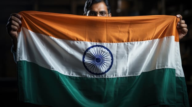 Hand holding India flag photo
