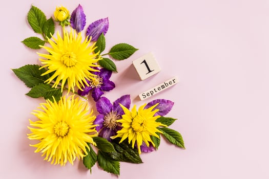 Festive flower composition on the white wooden background. Overhead view. photo