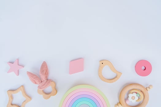 Newborn wooden toys and a star on a white background photo