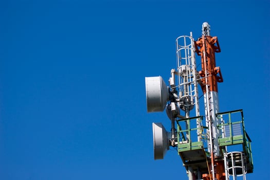 a cell phone tower with two antennas photo