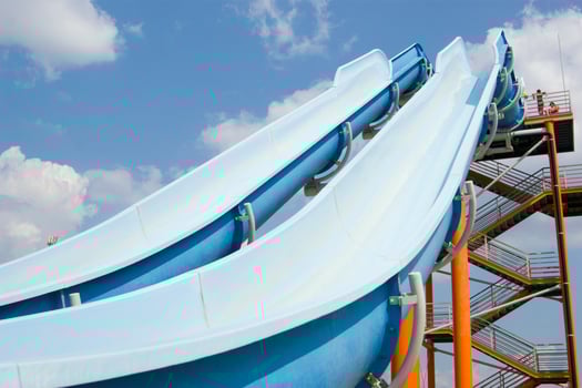a blue slide in a water park photo