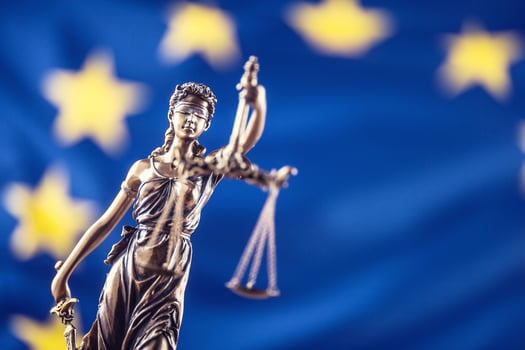 Lady Justice and European Union flag. Symbol of law and justice with EU Flag photo