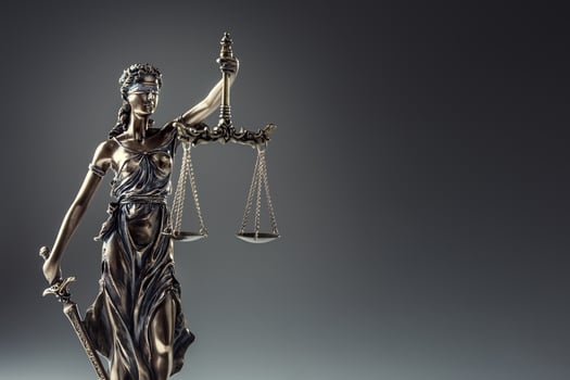 Statute of Justice. Bronze statue Lady Justice holding scales and sword photo