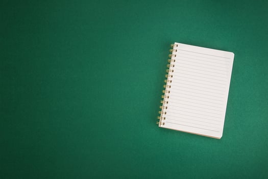 School clear notebook on a green background. photo