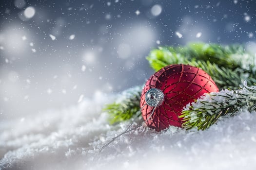Christmas red Luxury ball in snow and abstract snowy atmosphere photo