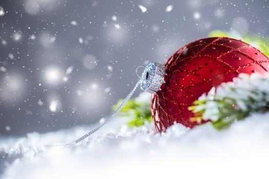 Christmas red Luxury ball in snow and abstract snowy atmosphere photo