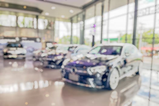 new cars in showroom interior blurred abstract background photo