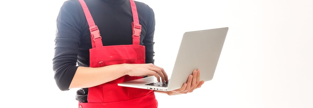 Mechanic with laptop over white background photo