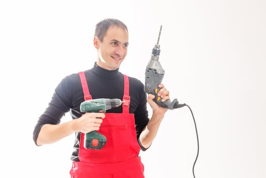 Worker holding cordless drill photo