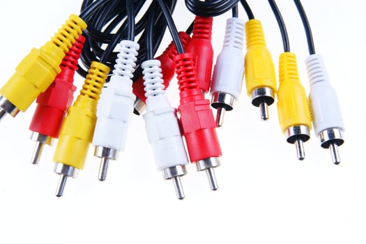 several different colored cables with different colored plugs photo