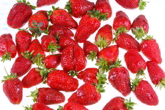 a glass bowl filled with strawberries photo
