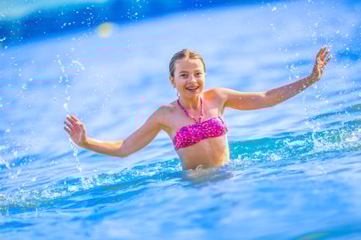 Happy teen girl enjoing summer water and holidays in holiday destinations. photo