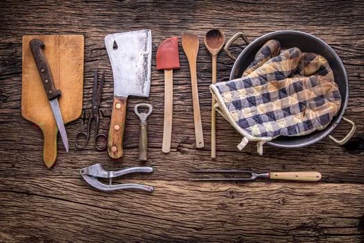 Top of view on Vintage kitchen utensils on rustic wood background. photo