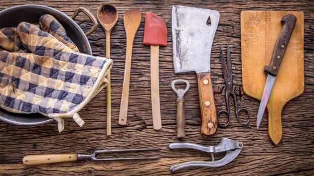 Top of view on Vintage kitchen utensils on rustic wood background. photo