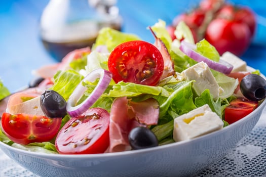 Salad. Fresh summer lettuce salad.Healthy mediterranean salad olives tomatoes parmesan cheese and prosciutto photo