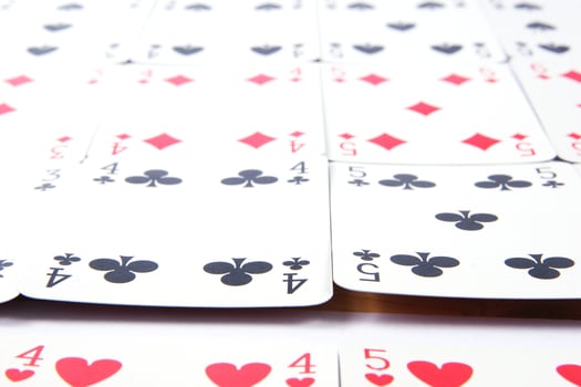 a pile of playing cards on a table photo