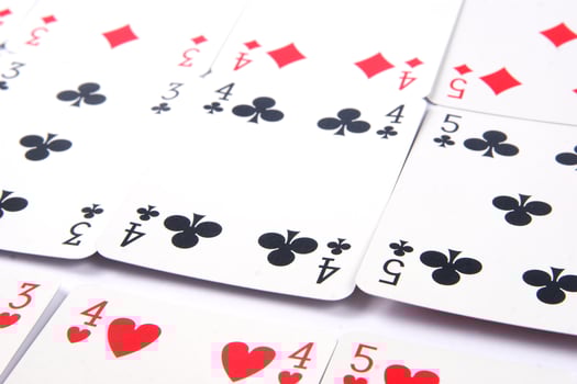 a pile of playing cards on a table photo