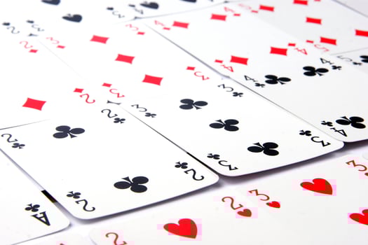 a pile of playing cards on a table photo