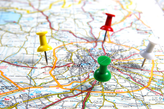 a red push pin is on a map of a city photo