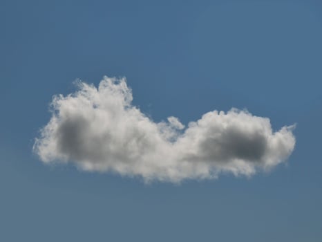 Single white cloud over blue sky background. Fluffy cumulus cloud shape photo