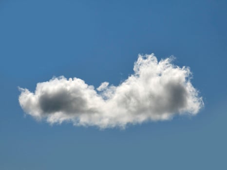 Single white cloud over blue sky background. Fluffy cumulus cloud shape photo