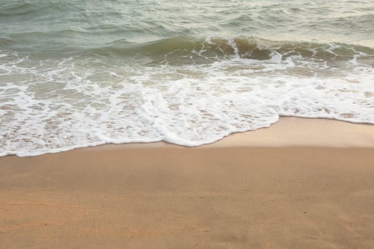 Sea Foam Wave Crashes on the Sand Beach. Summer Copyspace. photo