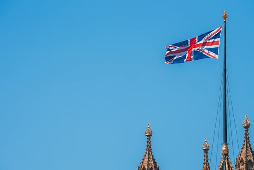 UK flag with Big Ben and House of Parliament in the background photo