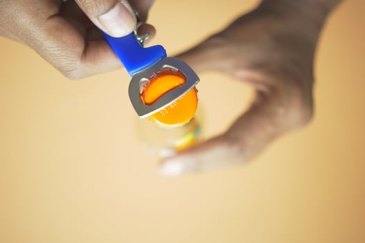 Metal cap and opener on the glass bottle photo