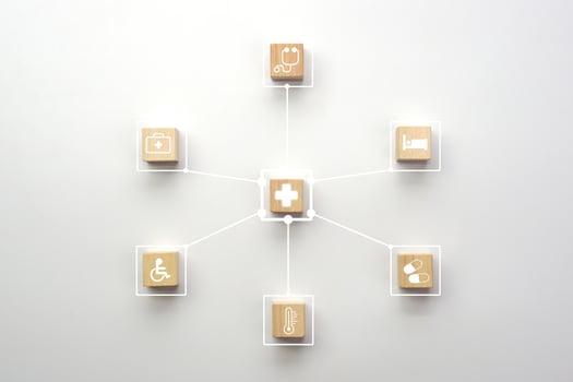Medical icons on wooden cube block with connection link network. Health care, health insurance and treatment concept. photo