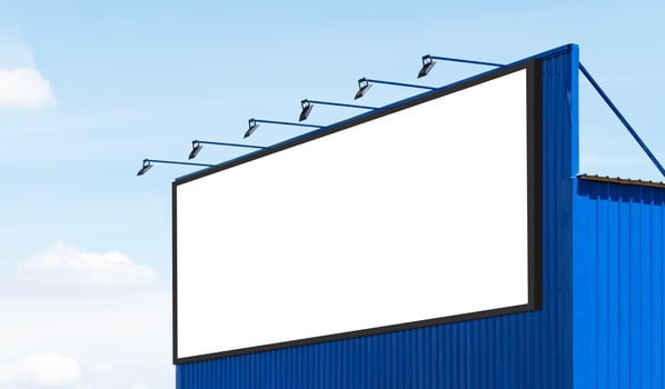 Mock up white background billboard on blue building with spot light photo