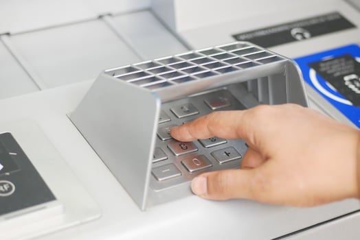 close up women hand pressing on atm machine, photo