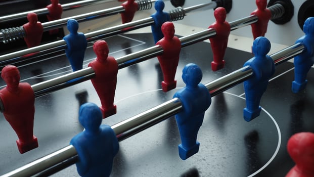 Football table or soccer table game with plastic player figurine. Mini Soccer game which famous in past and be collectable item for foosball lover. Play by two hand control each row of player figurine photo