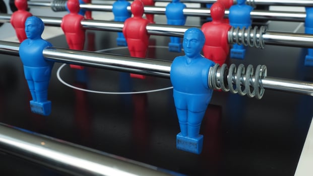 Football table or soccer table game with plastic player figurine. Mini Soccer game which famous in past and be collectable item for foosball lover. Play by two hand control each row of player figurine photo