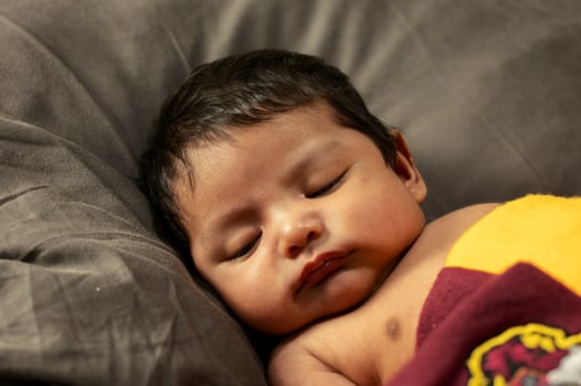 New Born session with a baby child sleeping quiet photo