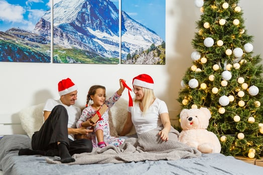 Family in Christmas Hat, Baby Mother and Father, Three persons looking at camera on White background photo