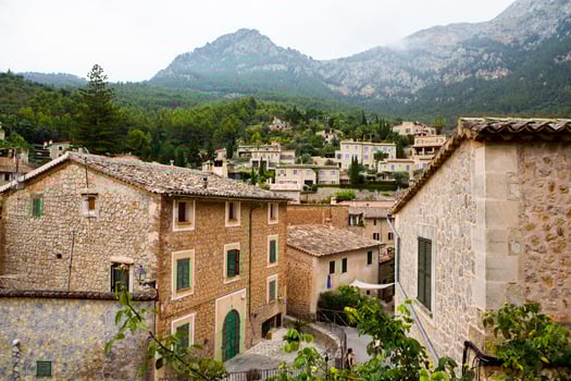 View of a medieval street in the Old Town of the picturesque Spanish-style village Deia, Majorca or Mallorca island photo