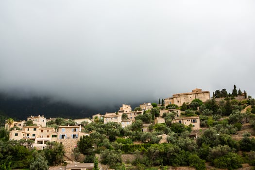 View of a medieval street in the Old Town of the picturesque Spanish-style village Deia, Majorca or Mallorca island photo