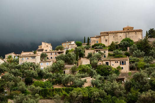 View of a medieval street in the Old Town of the picturesque Spanish-style village Deia, Majorca or Mallorca island photo