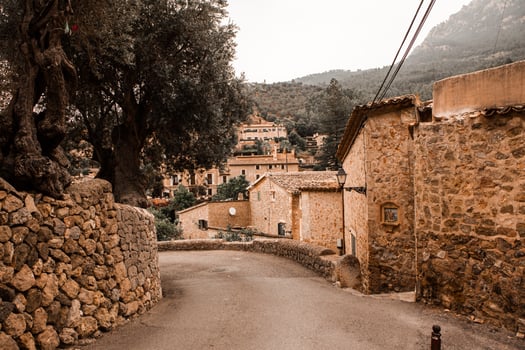 View of a medieval street in the Old Town of the picturesque Spanish-style village Deia, Majorca or Mallorca island photo