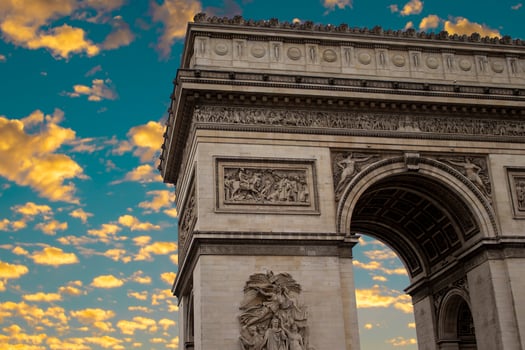 Champs-Elysees at Sunset in Paris, France. Romantic Travel Background. Amazing Panorama of Paris with Arc de Triomphe photo