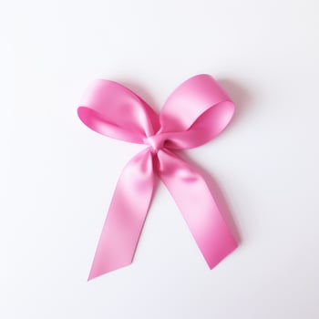 A pink ribbon on a white background. Breast Cancer Month. photo