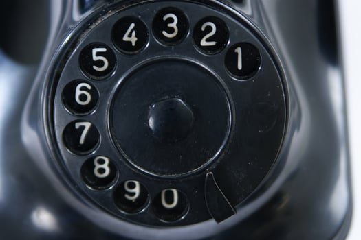 a black telephone on a white background photo