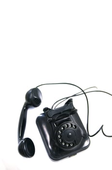 a black telephone on a white background photo