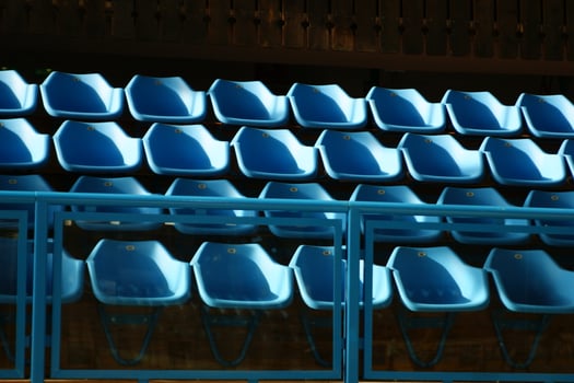 a row of blue chairs photo