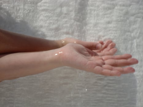 a person's hand is wet photo