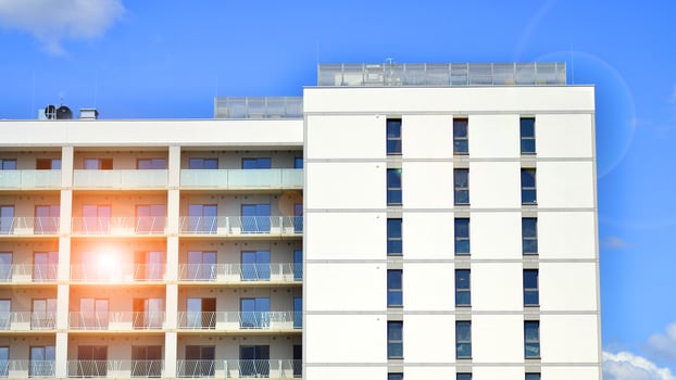 Modern apartment buildings on a sunny day with a blue sky. Facade of a modern apartment building photo