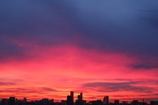Colorful cloudy twilight beautiful sky cityscape sunset and morning sunrise. Dramatic evening night early morning view with city buildings silhouette. Panoramic background concept. Copy space for text photo