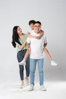 a family posing on a white background photo