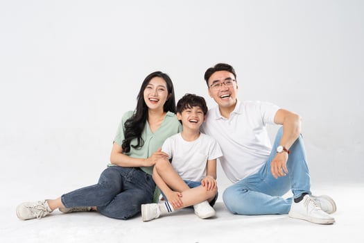 a family posing on a white background photo