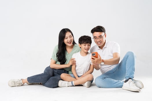 a family posing on a white background photo